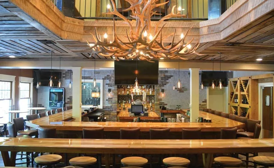 Antler chandeliers over the long bar at Buck Hill Brewery & Restaurant