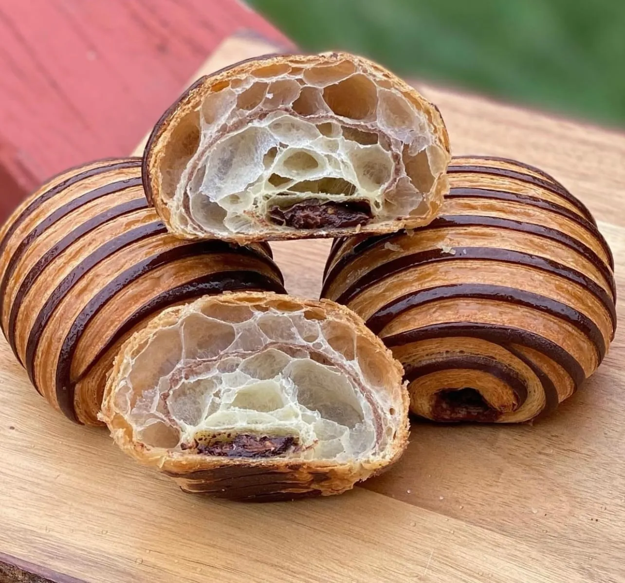 Pains au chocolat cut open to show their layers at Chocolatine