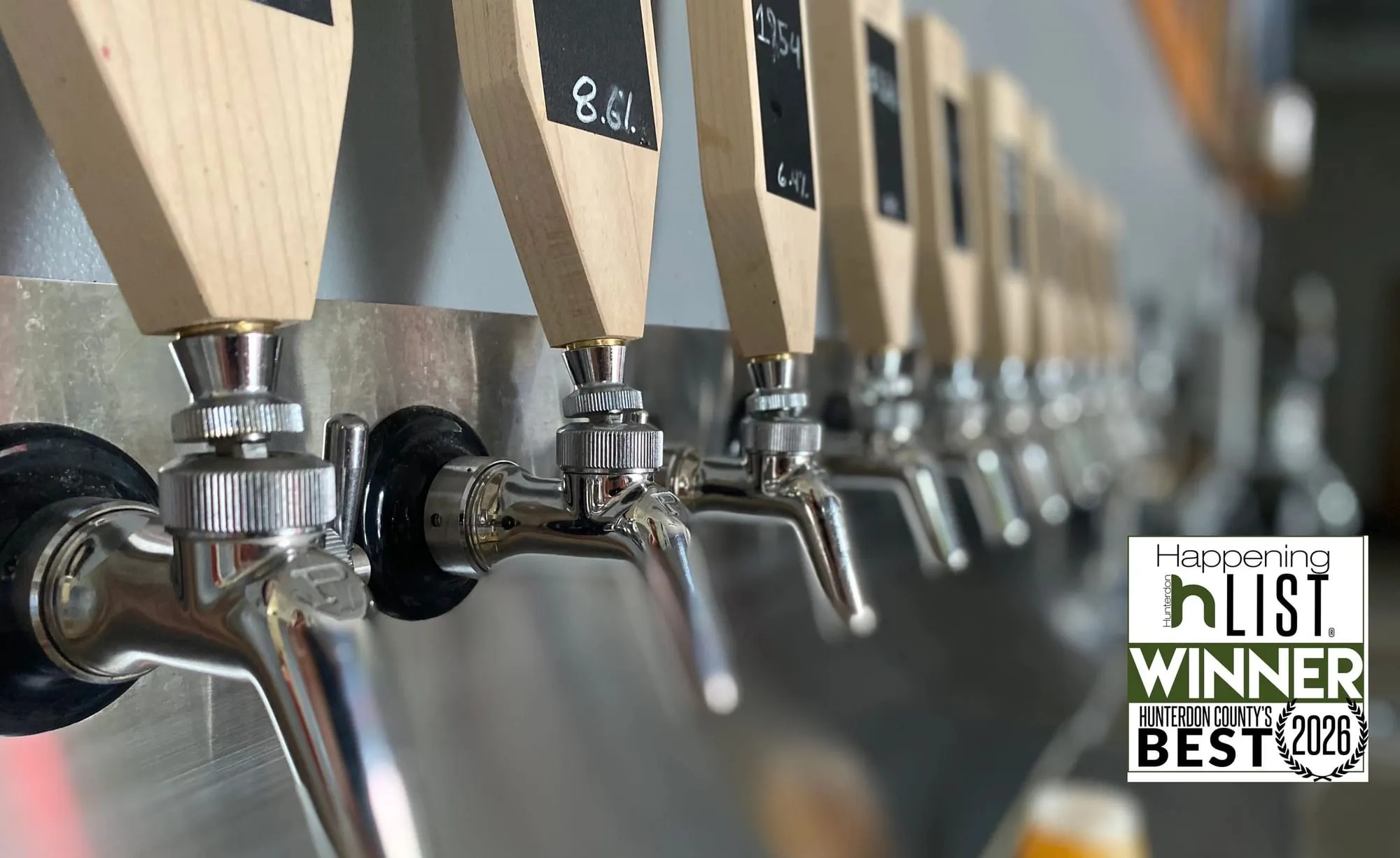 A row of tap handles at Invertase Brewing