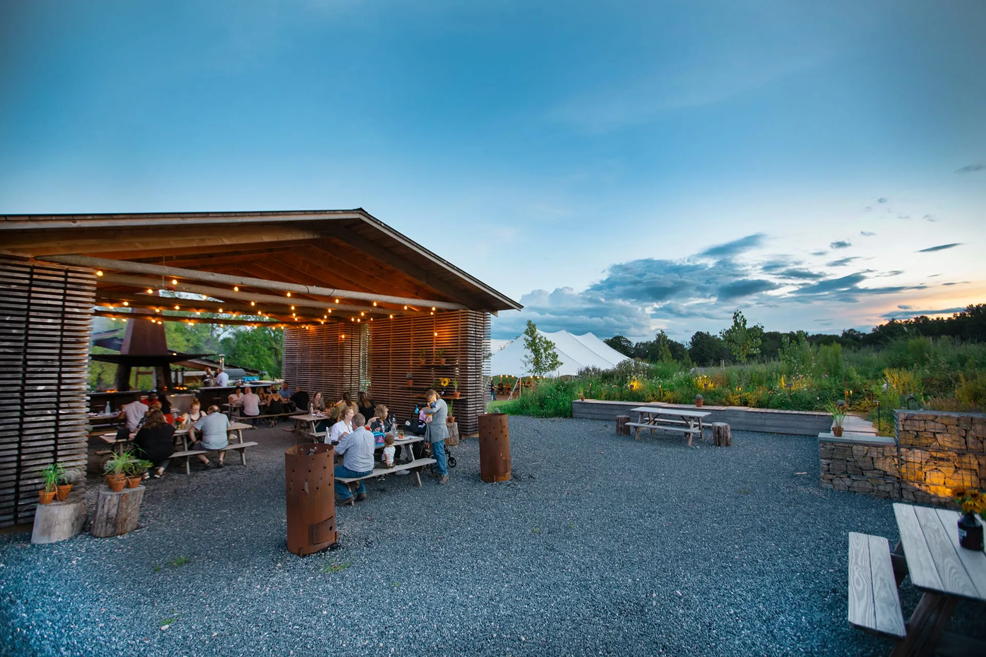 Ironbound Farm’s open-air cider pavilion at dusk