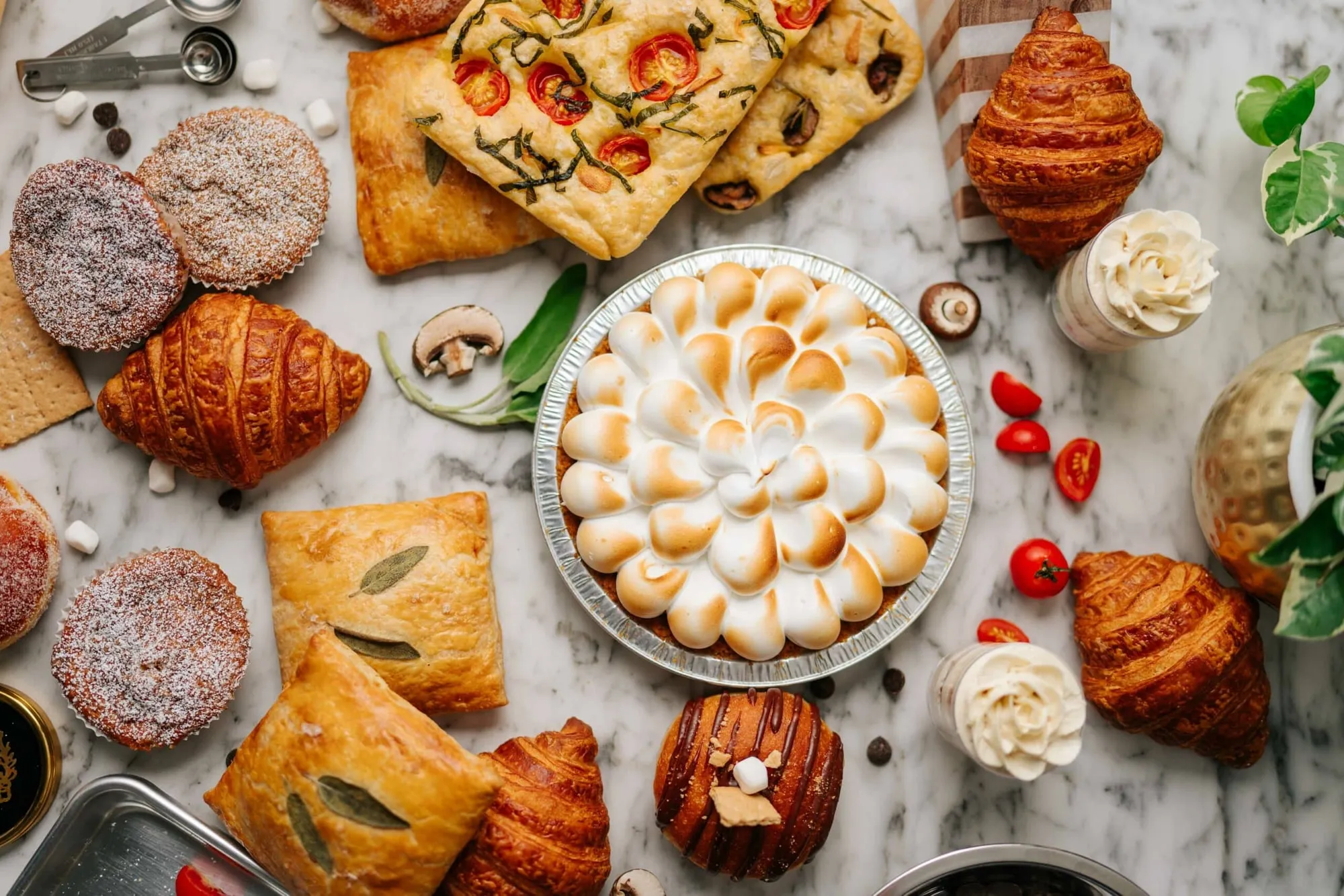 Croissants, hand pies, focaccia and a meringue pie from Kirshenbaum Baking Co., seen from above