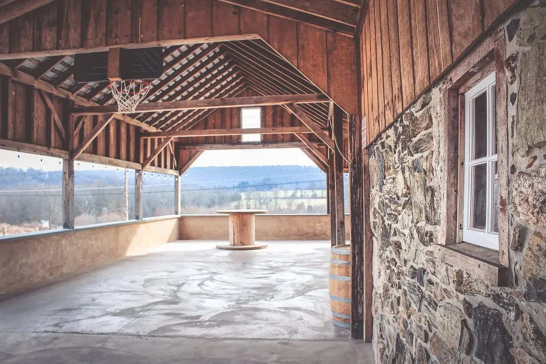 The stone-walled covered porch at Little Ridge Vineyards looking out over the hills